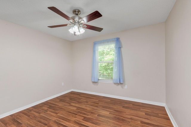 1184 Blackberry Cir, Baker, FL 32531 - spare room featuring wood finished floors, baseboards, and a ceiling fan