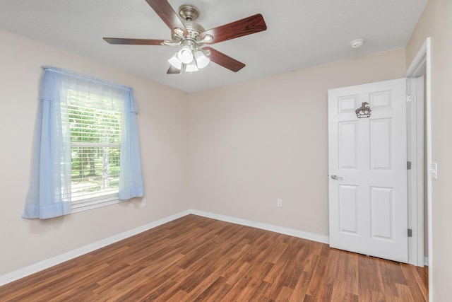 1184 Blackberry Cir, Baker, FL 32531 - unfurnished room with wood finished floors, baseboards, ceiling fan, and a smoke detector