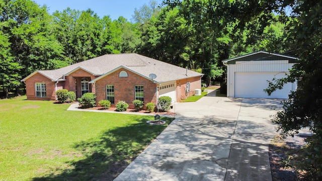 1184 Blackberry Cir, Baker, FL 32531 - ranch-style home featuring concrete driveway, a front yard, an attached garage, an outdoor structure, and brick siding