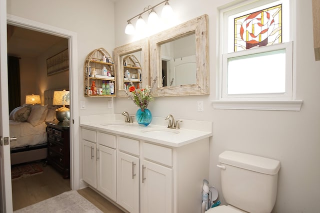 14 Cool Breeze, Freeport, FL 32439 - full bath with ensuite bath, wood finished floors, double vanity, and toilet