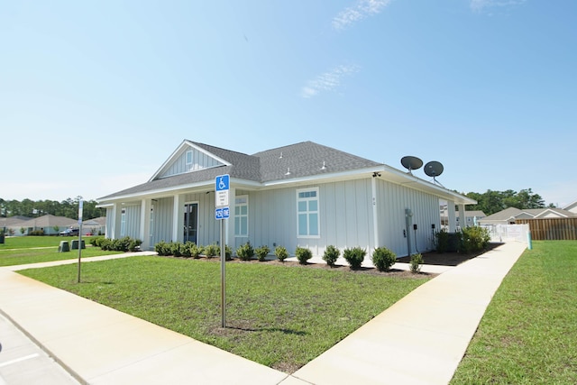 14 Cool Breeze, Freeport, FL 32439 - view of front facade with board and batten siding and a shingled roof