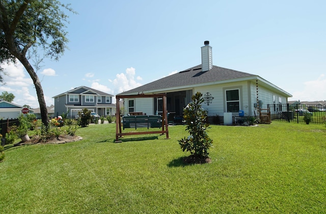 14 Cool Breeze, Freeport, FL 32439 - back of house featuring a chimney and a shingled roof