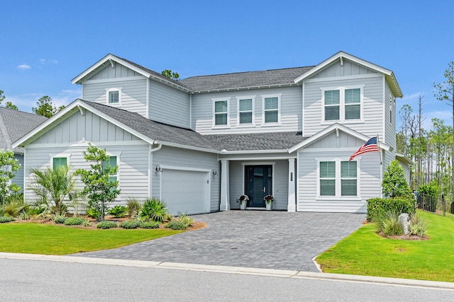 276 W Lafayette Rd, Inlet Beach, FL 32461 - view of front of home with a shingled roof, board and batten siding, and decorative driveway