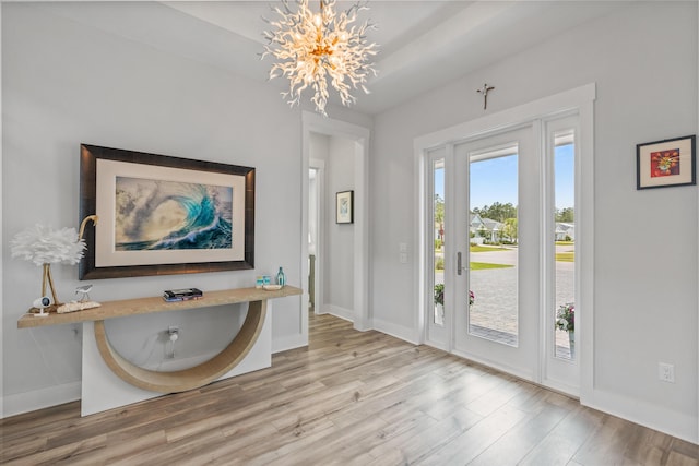 276 W Lafayette Rd, Inlet Beach, FL 32461 - entrance foyer featuring wood finished floors, a chandelier, and baseboards