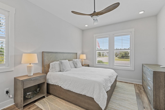 276 W Lafayette Rd, Inlet Beach, FL 32461 - bedroom featuring multiple windows, baseboards, wood finished floors, a ceiling fan, and recessed lighting