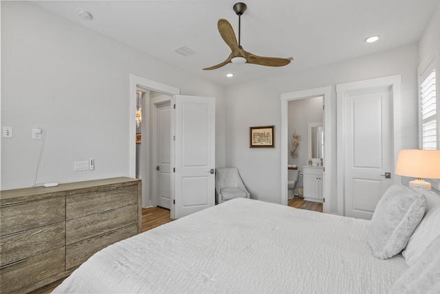 276 W Lafayette Rd, Inlet Beach, FL 32461 - bedroom with wood finished floors, recessed lighting, ceiling fan, and ensuite bath