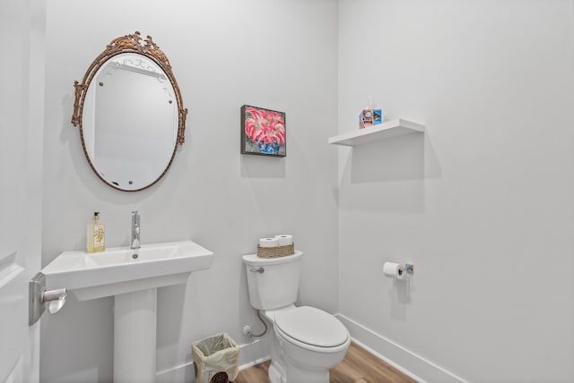 276 W Lafayette Rd, Inlet Beach, FL 32461 - half bath with wood finished floors, toilet, and baseboards