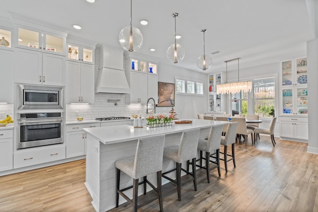 276 W Lafayette Rd, Inlet Beach, FL 32461 - kitchen with appliances with stainless steel finishes, custom range hood, light countertops, backsplash, and recessed lighting