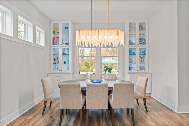 276 W Lafayette Rd, Inlet Beach, FL 32461 - dining area with wood finished floors and baseboards