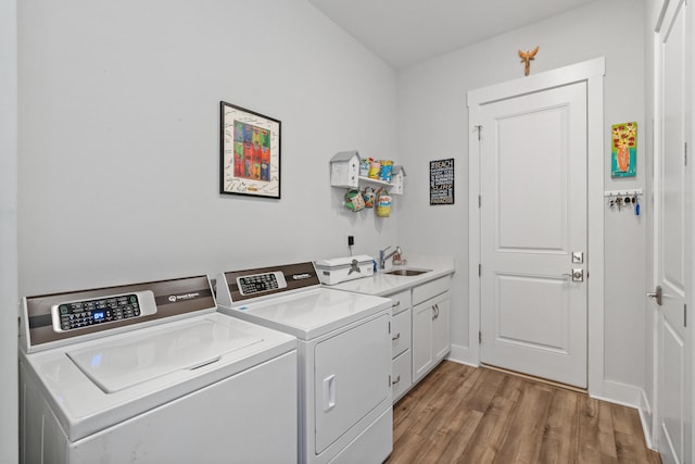 276 W Lafayette Rd, Inlet Beach, FL 32461 - laundry area with cabinet space, washing machine and clothes dryer, light wood finished floors, and baseboards