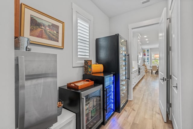 276 W Lafayette Rd, Inlet Beach, FL 32461 - corridor with light wood finished floors and wine cooler