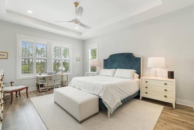 276 W Lafayette Rd, Inlet Beach, FL 32461 - bedroom with a raised ceiling, wood finished floors, recessed lighting, baseboards, and ceiling fan