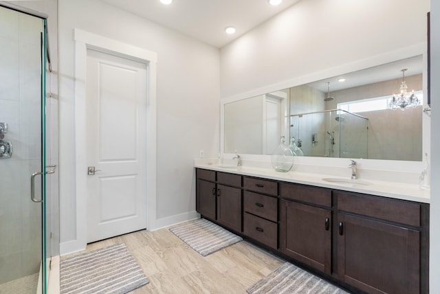 276 W Lafayette Rd, Inlet Beach, FL 32461 - full bath with a shower stall, double vanity, baseboards, recessed lighting, and a chandelier