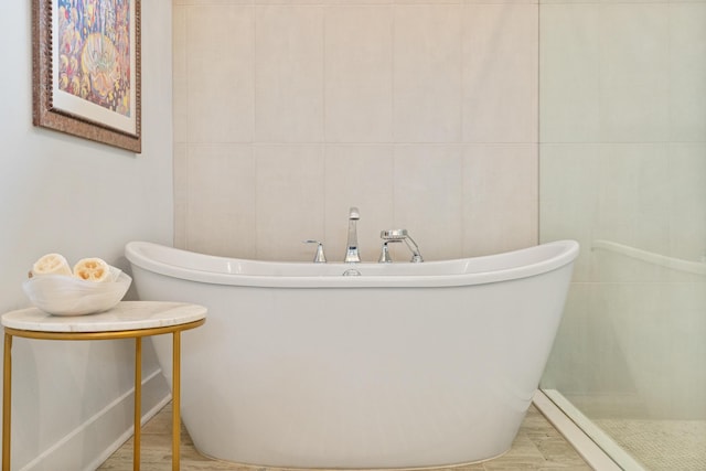 276 W Lafayette Rd, Inlet Beach, FL 32461 - bathroom with a freestanding tub and wood finished floors