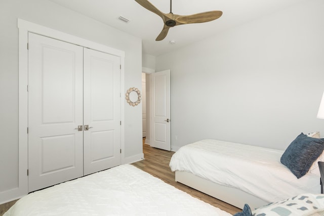 276 W Lafayette Rd, Inlet Beach, FL 32461 - bedroom with wood finished floors, a closet, a ceiling fan, and baseboards