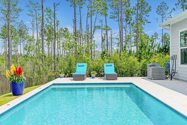 276 W Lafayette Rd, Inlet Beach, FL 32461 - view of swimming pool featuring central AC and a patio