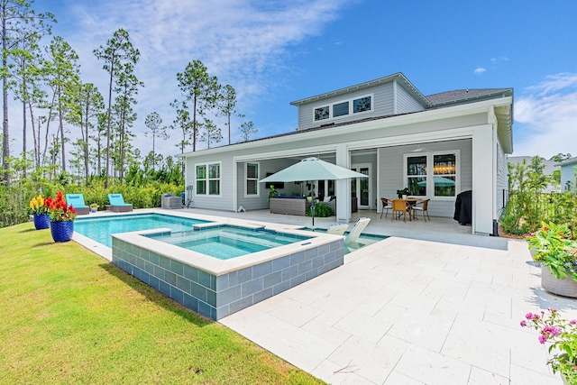 276 W Lafayette Rd, Inlet Beach, FL 32461 - view of swimming pool featuring a patio, a yard, central AC unit, outdoor dining space, and a pool with connected hot tub