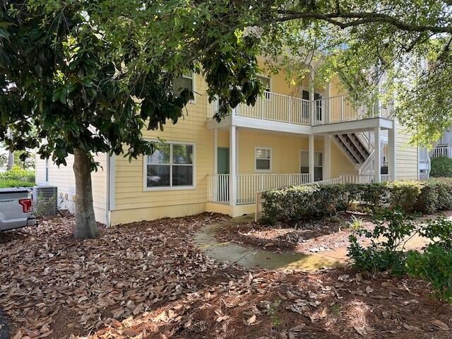 200 Sandestin Ln Apt 401, Miramar Beach, FL 32550 - back of house featuring a porch and central AC unit