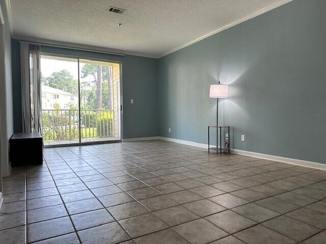 200 Sandestin Ln Apt 401, Miramar Beach, FL 32550 - empty room featuring crown molding, a textured ceiling, baseboards, and tile patterned floors
