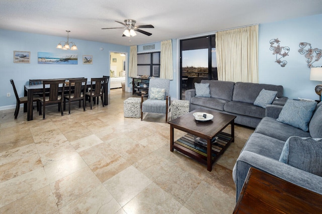 660 Nautilus Ct Unit 1103, Fort Walton Beach, FL 32548 - living area featuring ceiling fan, a chandelier, and baseboards