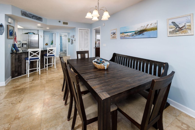 660 Nautilus Ct Unit 1103, Fort Walton Beach, FL 32548 - dining room featuring baseboards and a chandelier