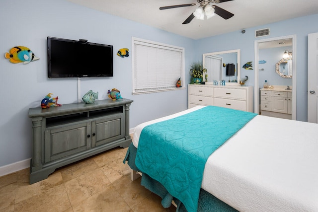 660 Nautilus Ct Unit 1103, Fort Walton Beach, FL 32548 - bedroom with baseboards, a ceiling fan, and connected bathroom