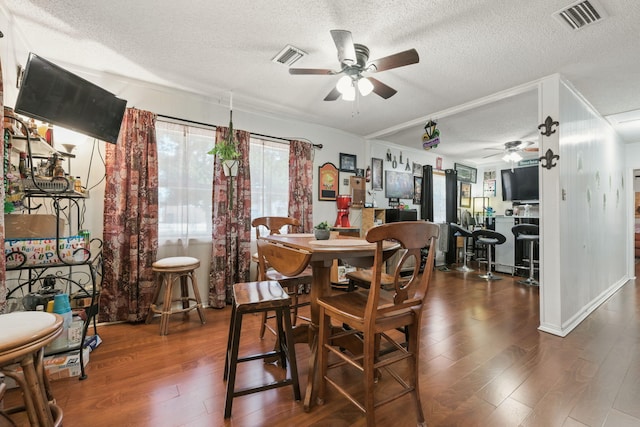 101 SE Elm Ave, Fort Walton Beach, FL 32548 - dining room with ceiling fan, a textured ceiling, and dark wood finished floors