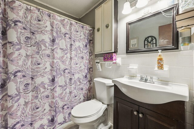 101 SE Elm Ave, Fort Walton Beach, FL 32548 - full bathroom with vanity, tile walls, a wainscoted wall, crown molding, and a shower with shower curtain