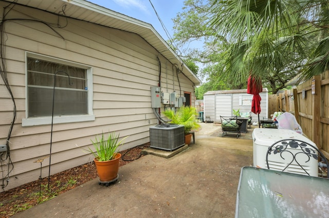 101 SE Elm Ave, Fort Walton Beach, FL 32548 - fenced backyard with a patio and a storage unit