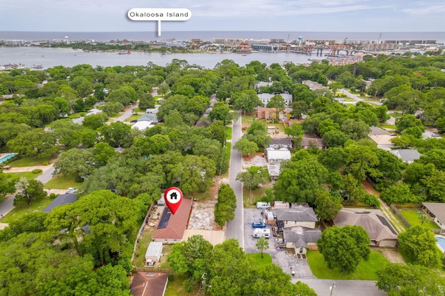 101 SE Elm Ave, Fort Walton Beach, FL 32548 - aerial perspective of suburban area featuring a nearby body of water and a tree filled landscape