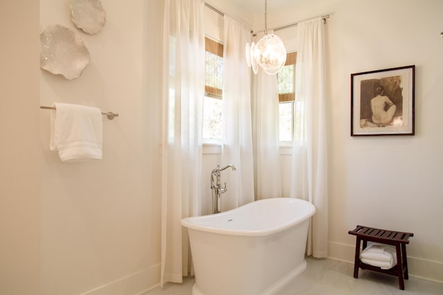 250 Beach Bike Way, Inlet Beach, FL 32461 - full bath with baseboards, a soaking tub, and a chandelier