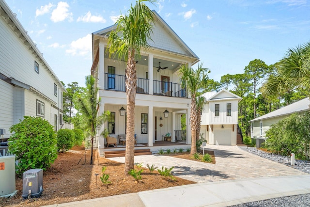 250 Beach Bike Way, Inlet Beach, FL 32461 - view of front facade with a balcony, board and batten siding, covered porch, ceiling fan, and an attached garage