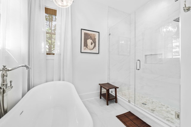 250 Beach Bike Way, Inlet Beach, FL 32461 - bathroom featuring marble look tile flooring, a freestanding tub, a marble finish shower, and baseboards