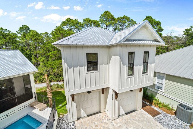 250 Beach Bike Way, Inlet Beach, FL 32461 - back of house featuring board and batten siding, central AC, a sunroom, and metal roof