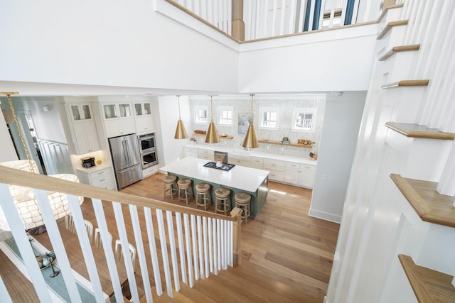 250 Beach Bike Way, Inlet Beach, FL 32461 - stairs featuring wood finished floors and a towering ceiling