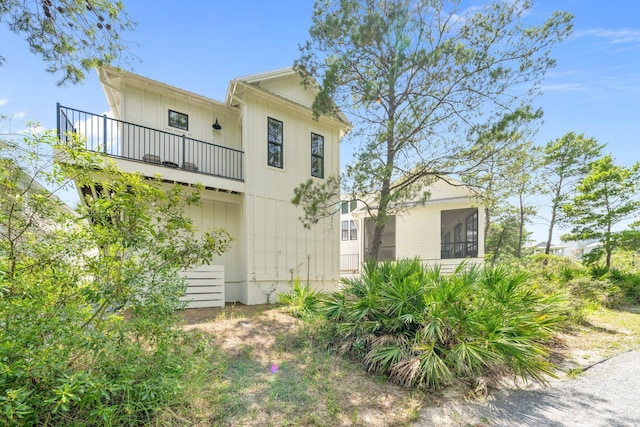 250 Beach Bike Way, Inlet Beach, FL 32461 - rear view of property with a balcony and a sunroom