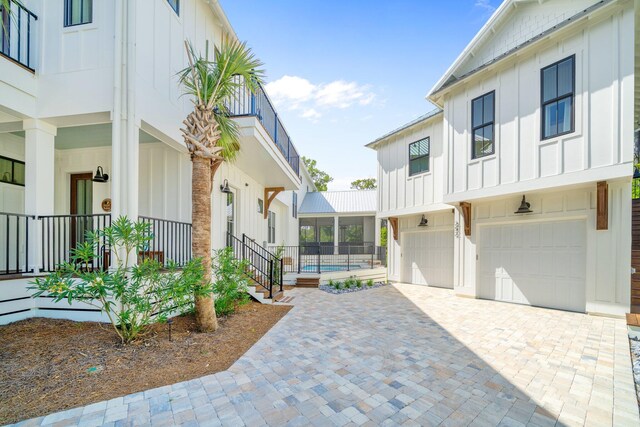 250 Beach Bike Way, Inlet Beach, FL 32461 - view of property exterior with board and batten siding, an attached garage, and decorative driveway