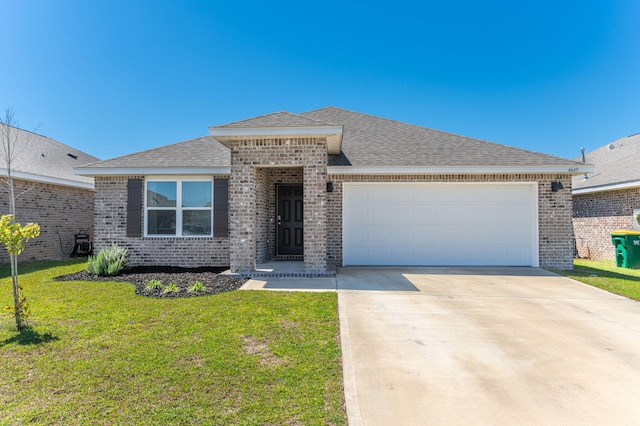 4649 Honor Guard Way, Crestview, FL 32539 - view of front facade featuring brick siding, an attached garage, driveway, a front yard, and roof with shingles