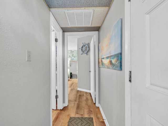 107 Surf Song Ln Unit A1, Miramar Beach, FL 32550 - corridor with light wood finished floors and baseboards