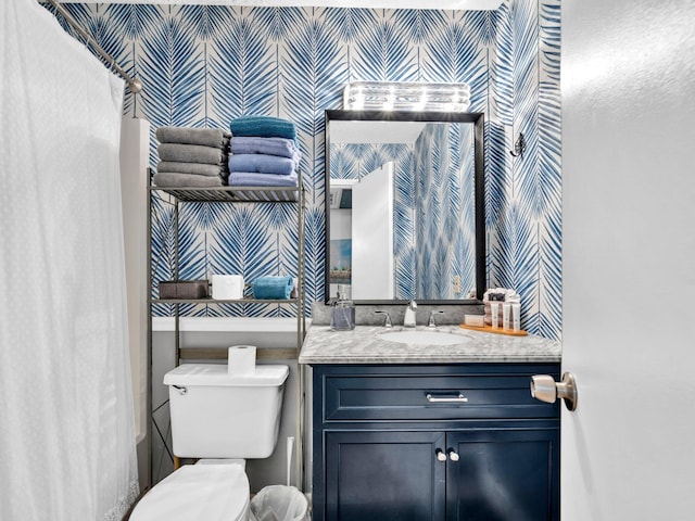 107 Surf Song Ln Unit A1, Miramar Beach, FL 32550 - bathroom with wallpapered walls, vanity, toilet, and shower / tub combo with curtain