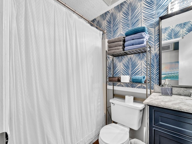 107 Surf Song Ln Unit A1, Miramar Beach, FL 32550 - full bath with wallpapered walls, toilet, and vanity