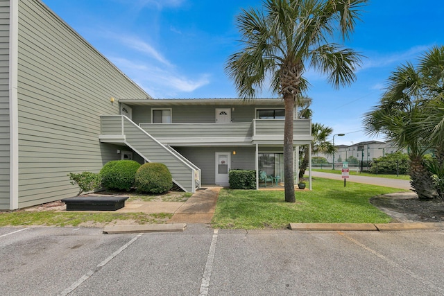 107 Surf Song Ln Unit A1, Miramar Beach, FL 32550 - view of property featuring stairway and uncovered parking