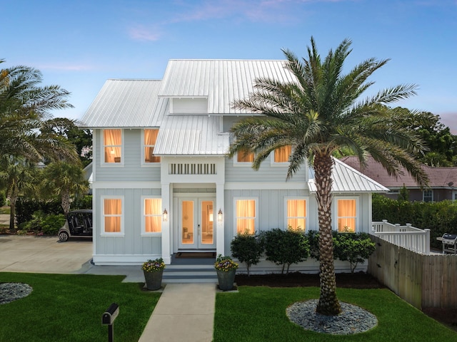 14 Bayshore Pines Ct, Miramar Beach, FL 32550 - view of front of home featuring french doors, board and batten siding, and metal roof