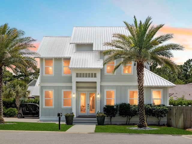 14 Bayshore Pines Ct, Miramar Beach, FL 32550 - view of front of property with board and batten siding, french doors, and metal roof