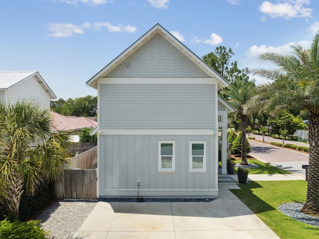 14 Bayshore Pines Ct, Miramar Beach, FL 32550 - view of side of property with board and batten siding