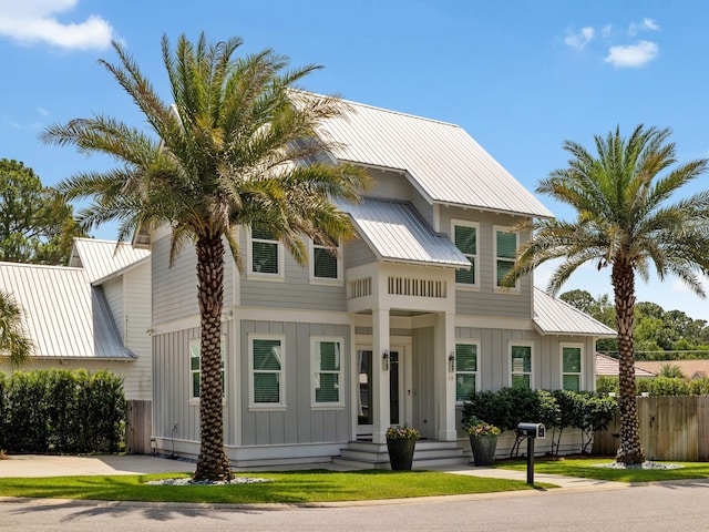 14 Bayshore Pines Ct, Miramar Beach, FL 32550 - view of front of house with board and batten siding and metal roof
