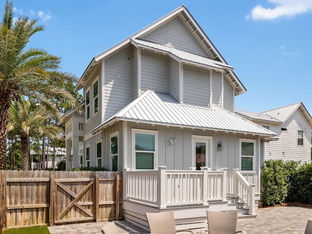 14 Bayshore Pines Ct, Miramar Beach, FL 32550 - multi unit property featuring board and batten siding, a gate, metal roof, and a standing seam roof