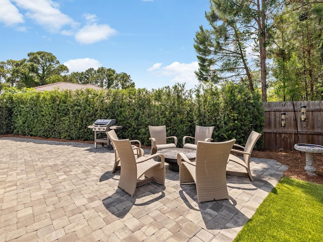14 Bayshore Pines Ct, Miramar Beach, FL 32550 - view of patio / terrace with an outdoor fire pit and a grill