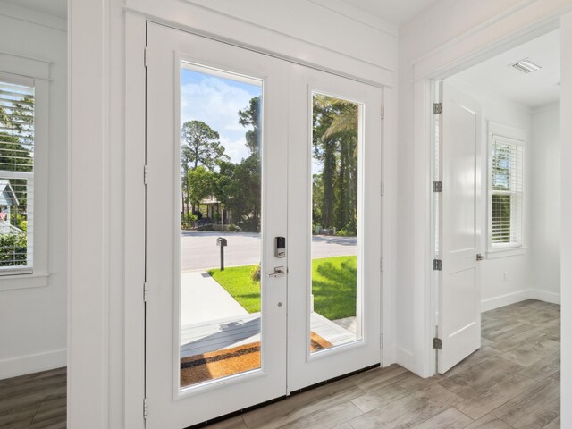 14 Bayshore Pines Ct, Miramar Beach, FL 32550 - doorway to outside featuring healthy amount of natural light, french doors, and wood finished floors