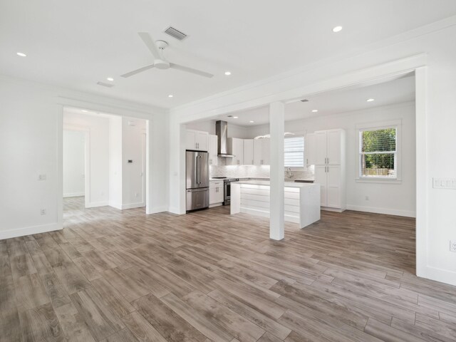 14 Bayshore Pines Ct, Miramar Beach, FL 32550 - unfurnished living room with ceiling fan, light wood-style flooring, ornamental molding, baseboards, and recessed lighting
